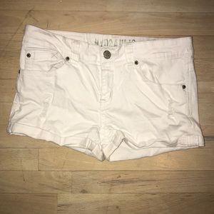 White jean shorts with rips